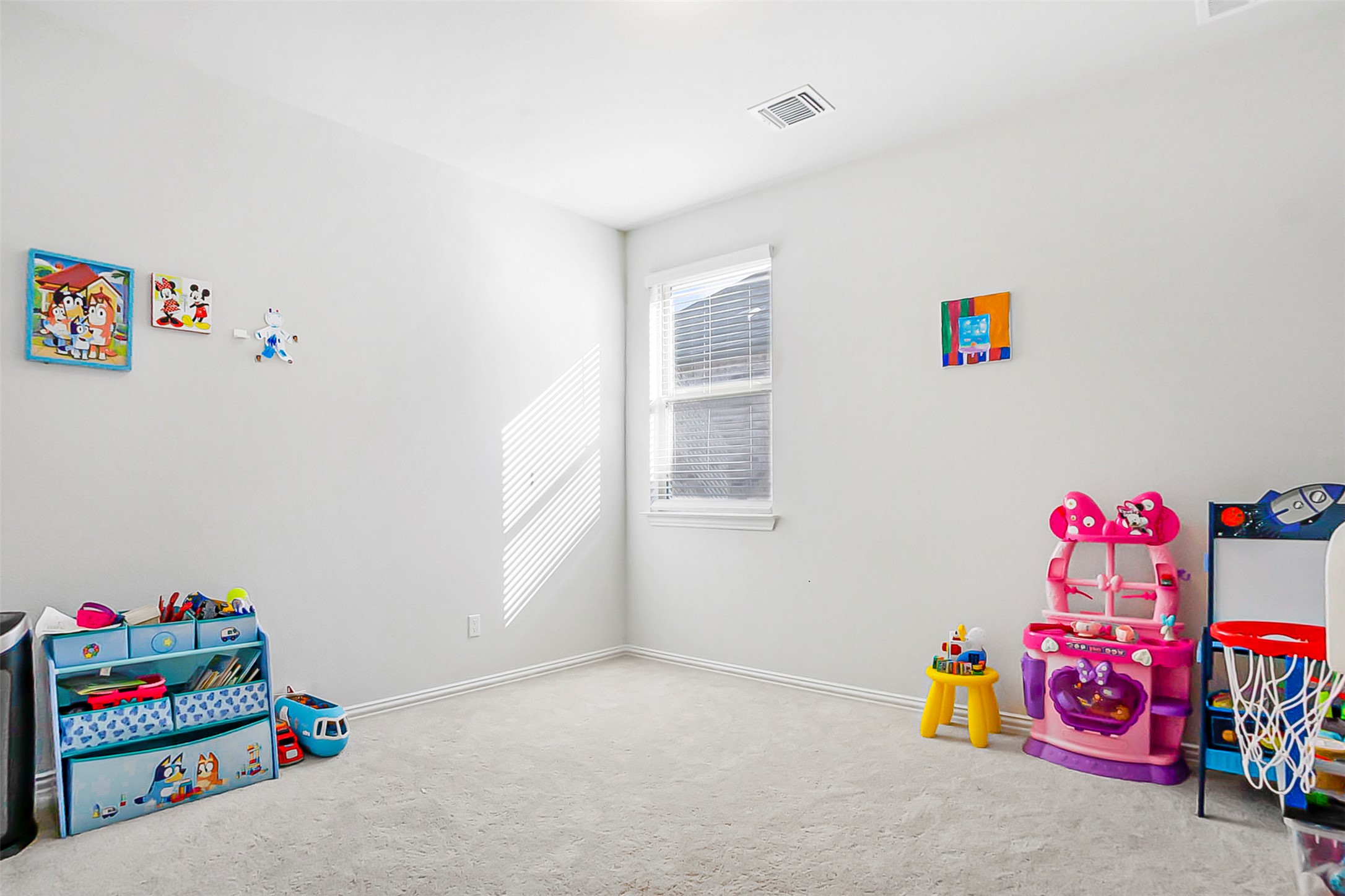 1016 Calendula Trail Georgetown, TX 78628 - Photo 29 of 40 Playroom with light carpet and baseboards