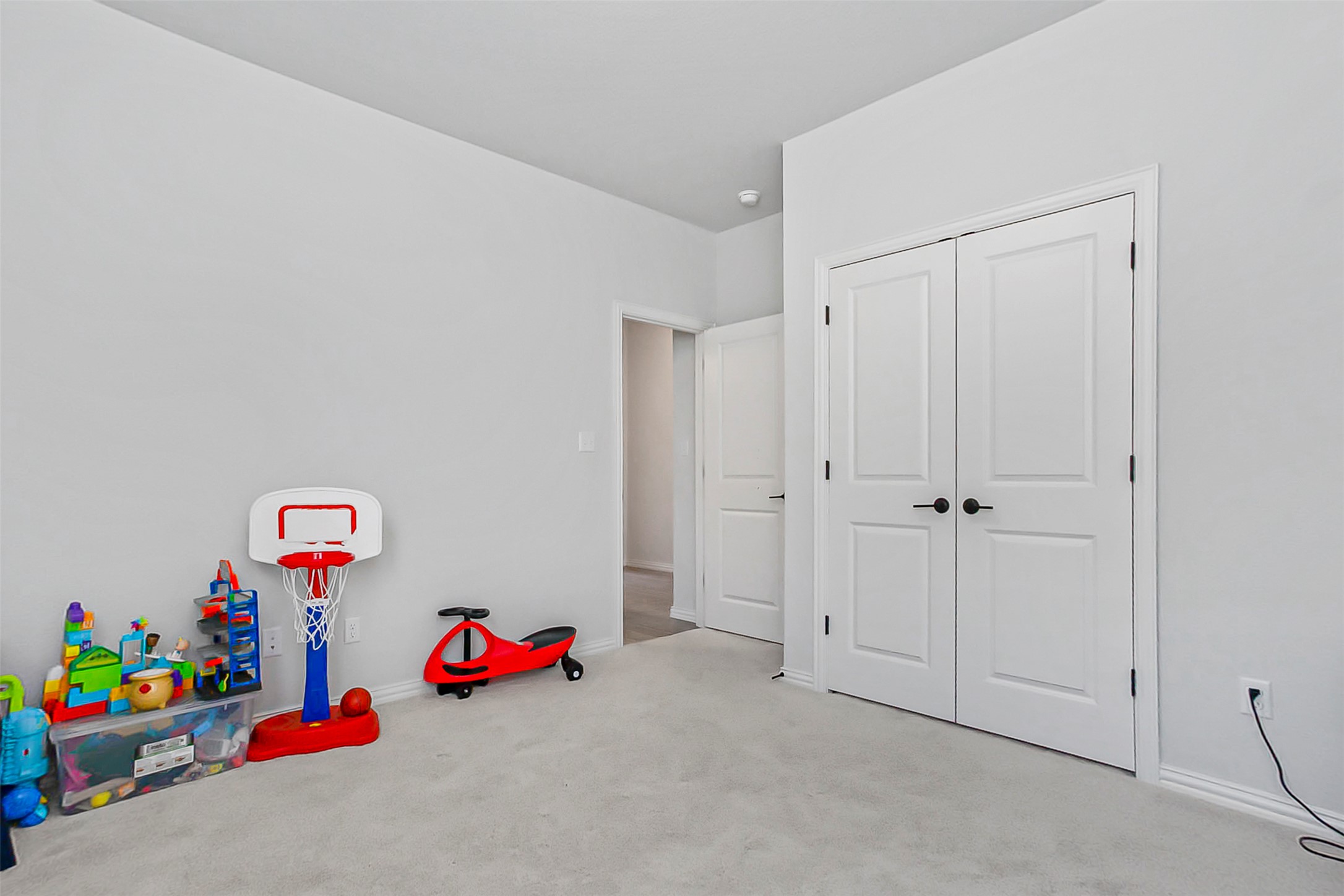 1016 Calendula Trail Georgetown, TX 78628 - Photo 30 of 40 Rec room with light carpet and baseboards