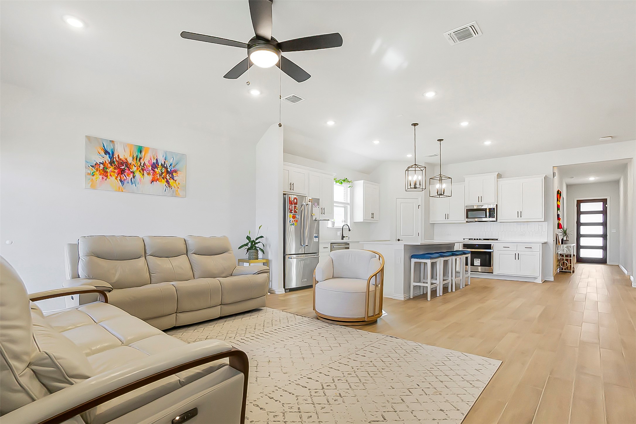 1016 Calendula Trail Georgetown, TX 78628 - Photo 6 of 40 Living area with light wood-style flooring, recessed lighting, a ceiling fan, and lofted ceiling