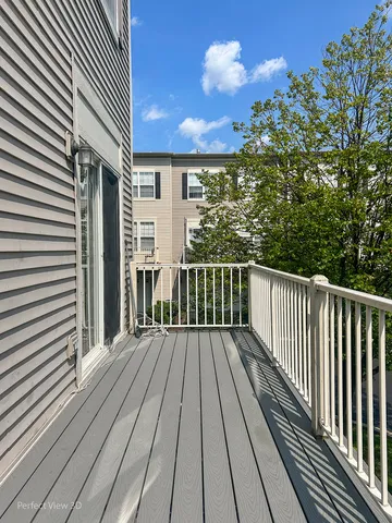 a view of balcony with wooden floor