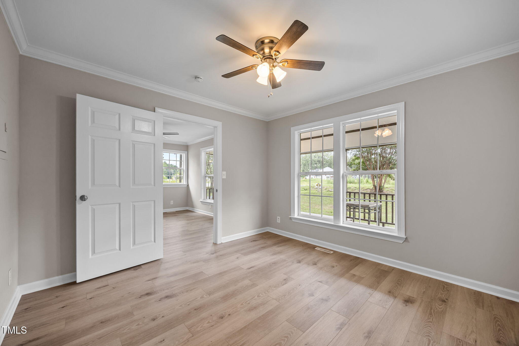 9900 Kennebec Church Road Angier, NC 27501 - Photo 14 of 41 a view of an empty room with wooden floor and a window