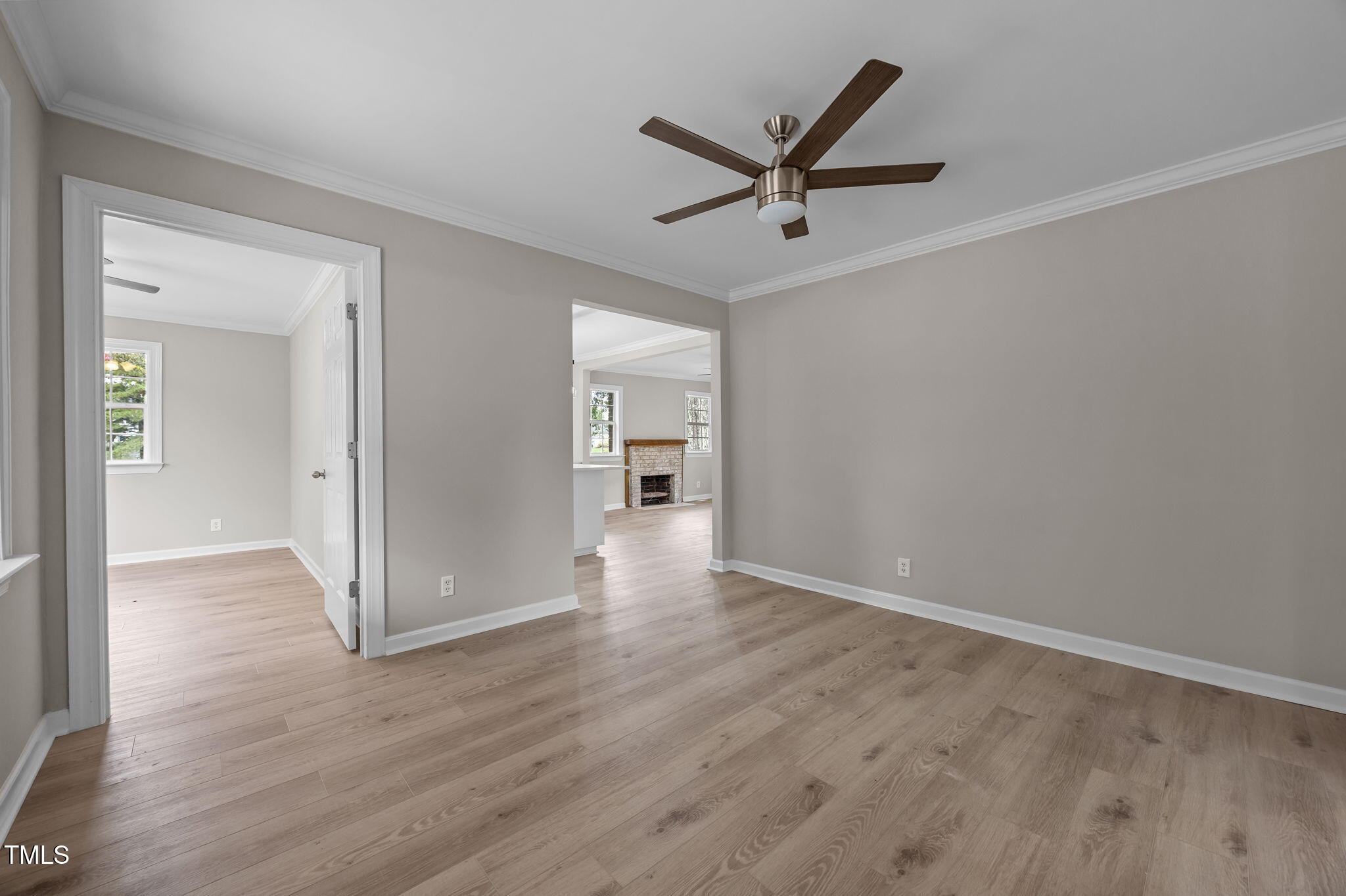 9900 Kennebec Church Road Angier, NC 27501 - Photo 17 of 41 a view of a livingroom with wooden floor and a ceiling fan