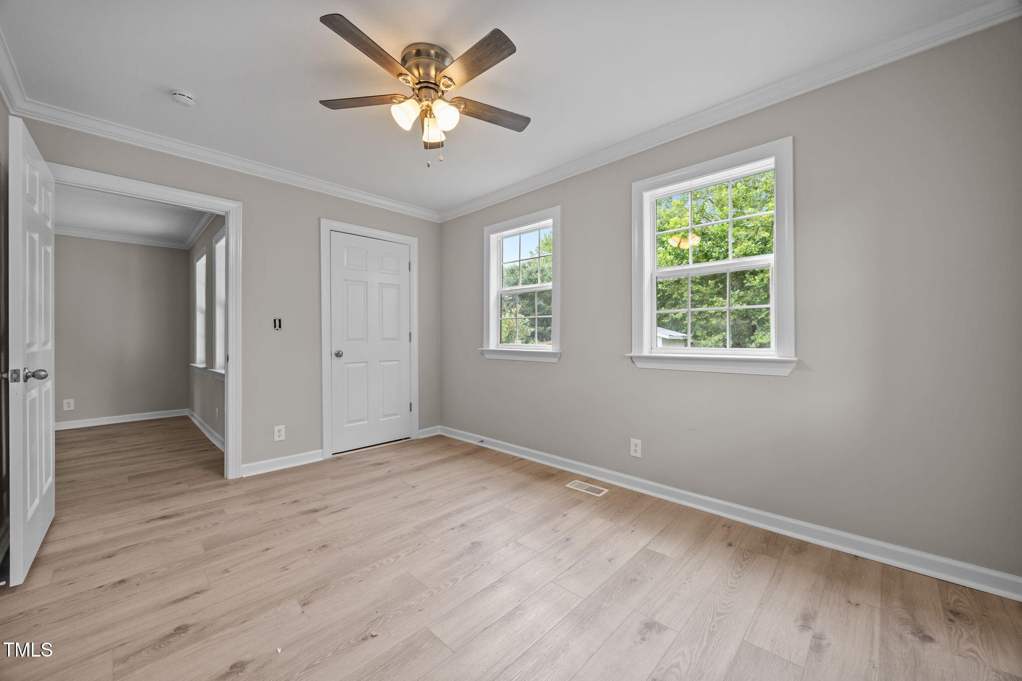 9900 Kennebec Church Road Angier, NC 27501 - Photo 20 of 41 a view of an empty room with a window and wooden floor