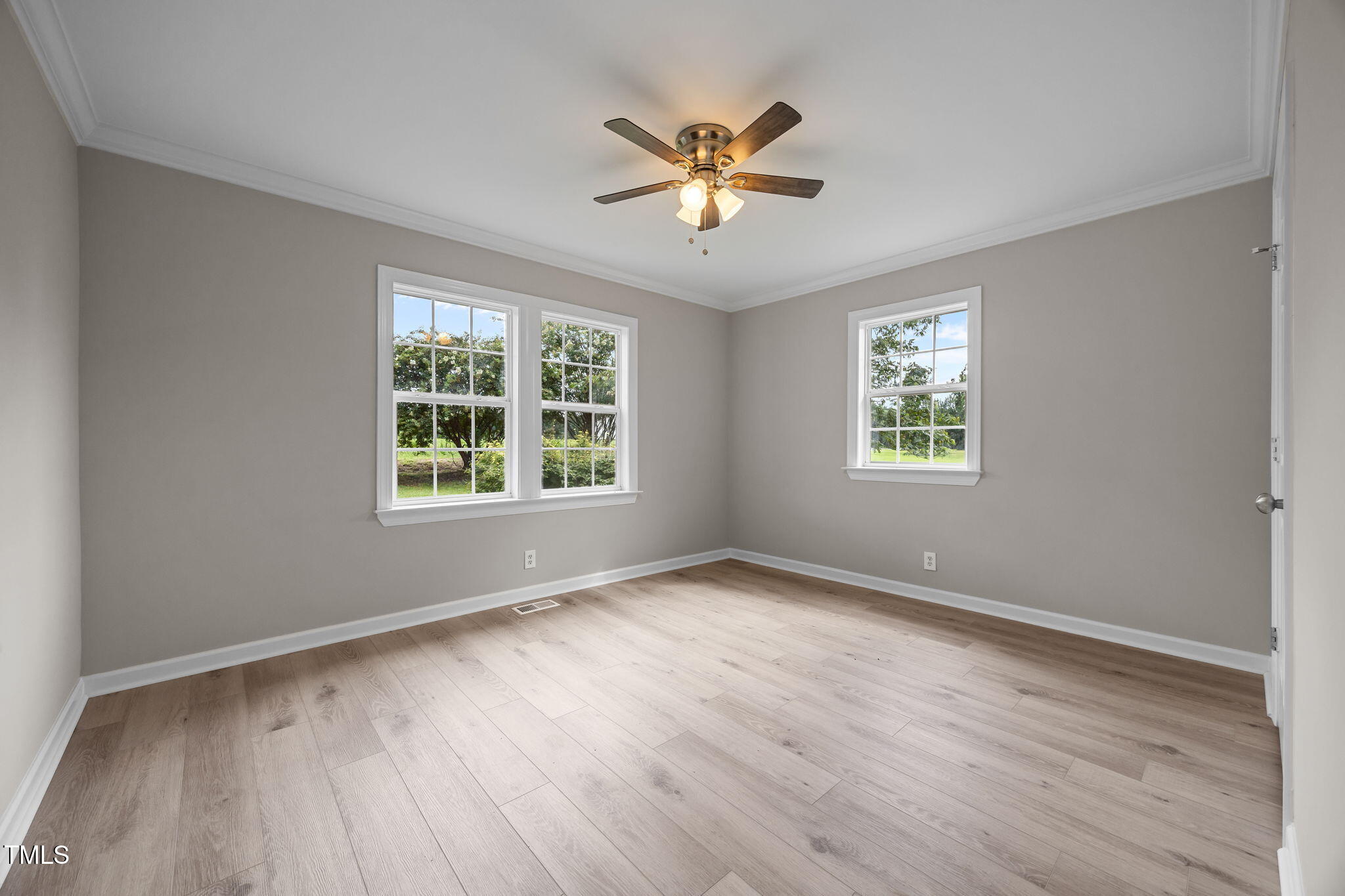 9900 Kennebec Church Road Angier, NC 27501 - Photo 22 of 41 a view of an empty room with a window and wooden floor