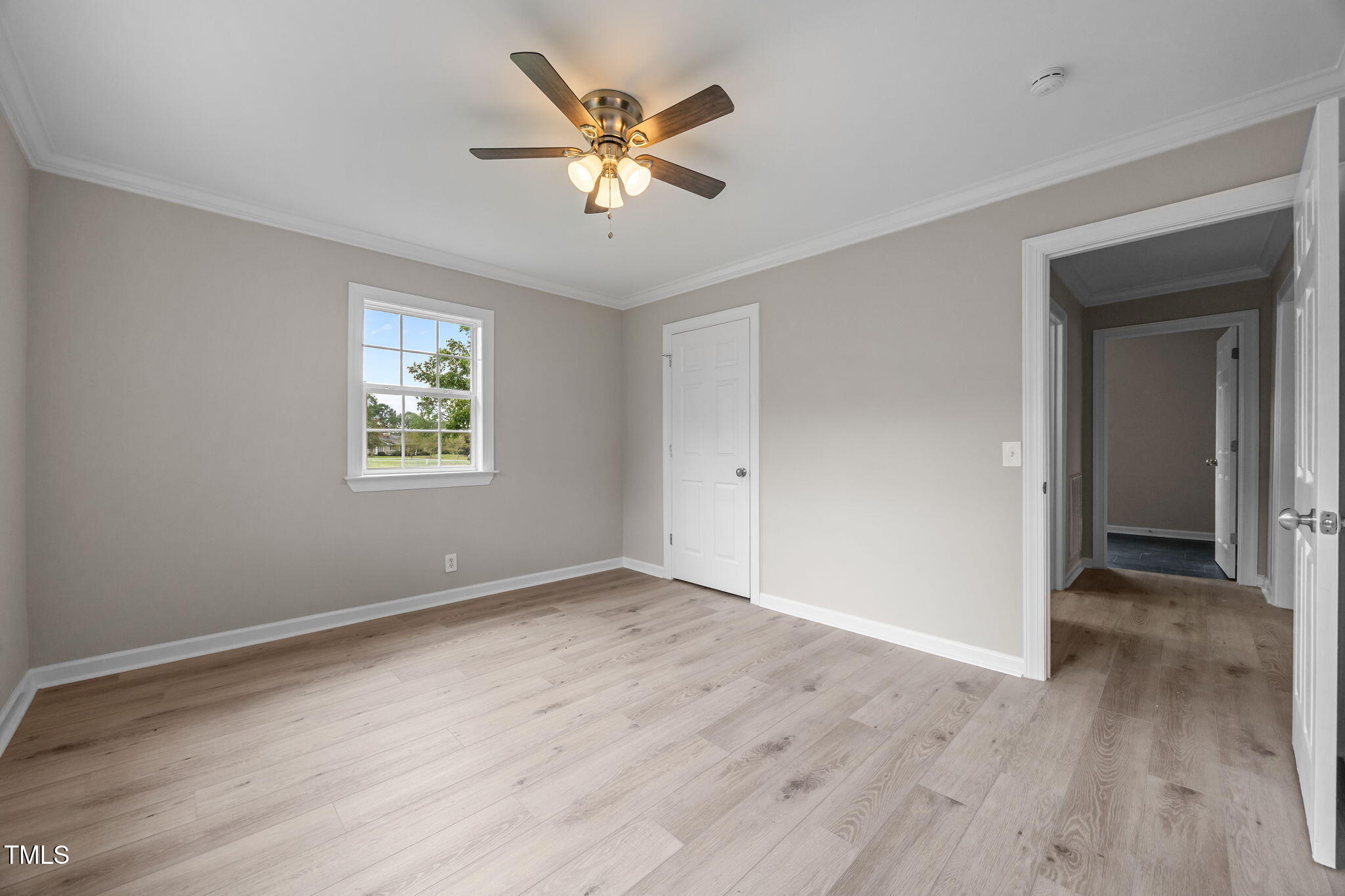 9900 Kennebec Church Road Angier, NC 27501 - Photo 24 of 41 an empty room with wooden floor and windows