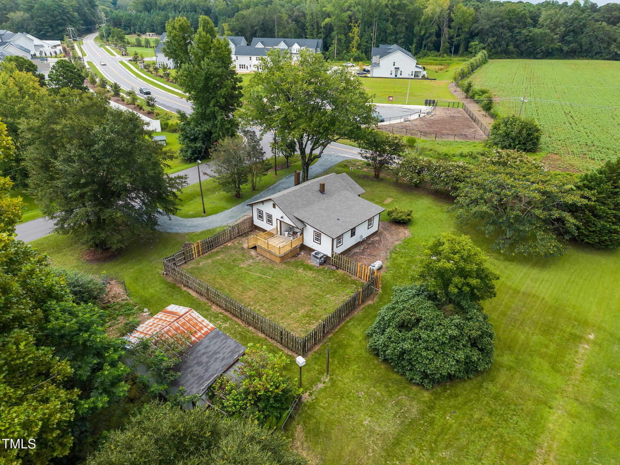 9900 Kennebec Church Road Angier, NC 27501 - Photo 32 of 41 an aerial view of a house with a garden and swimming pool