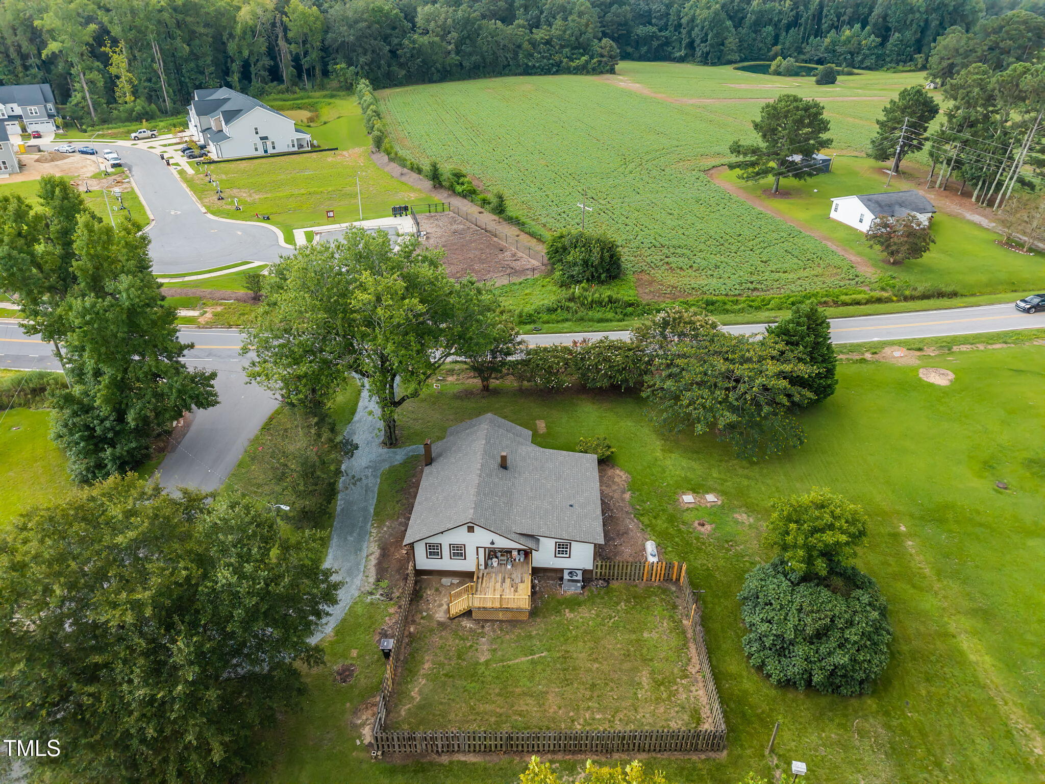 9900 Kennebec Church Road Angier, NC 27501 - Photo 33 of 41 an aerial view of a house with a garden and lake view