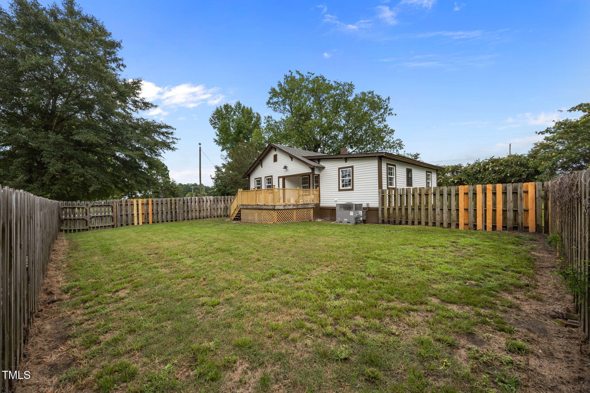 9900 Kennebec Church Road Angier, NC 27501 - Photo 37 of 41 a house with green field in front of it