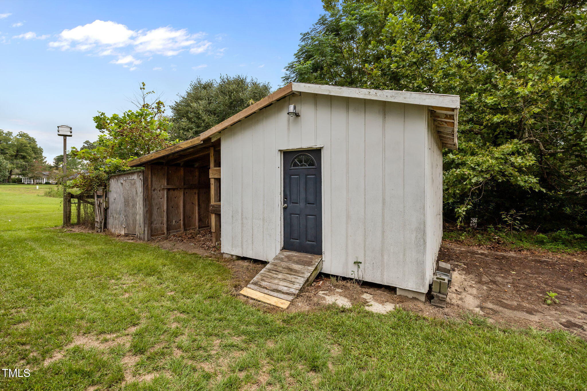 9900 Kennebec Church Road Angier, NC 27501 - Photo 39 of 41 a backyard of a house with lots of green space
