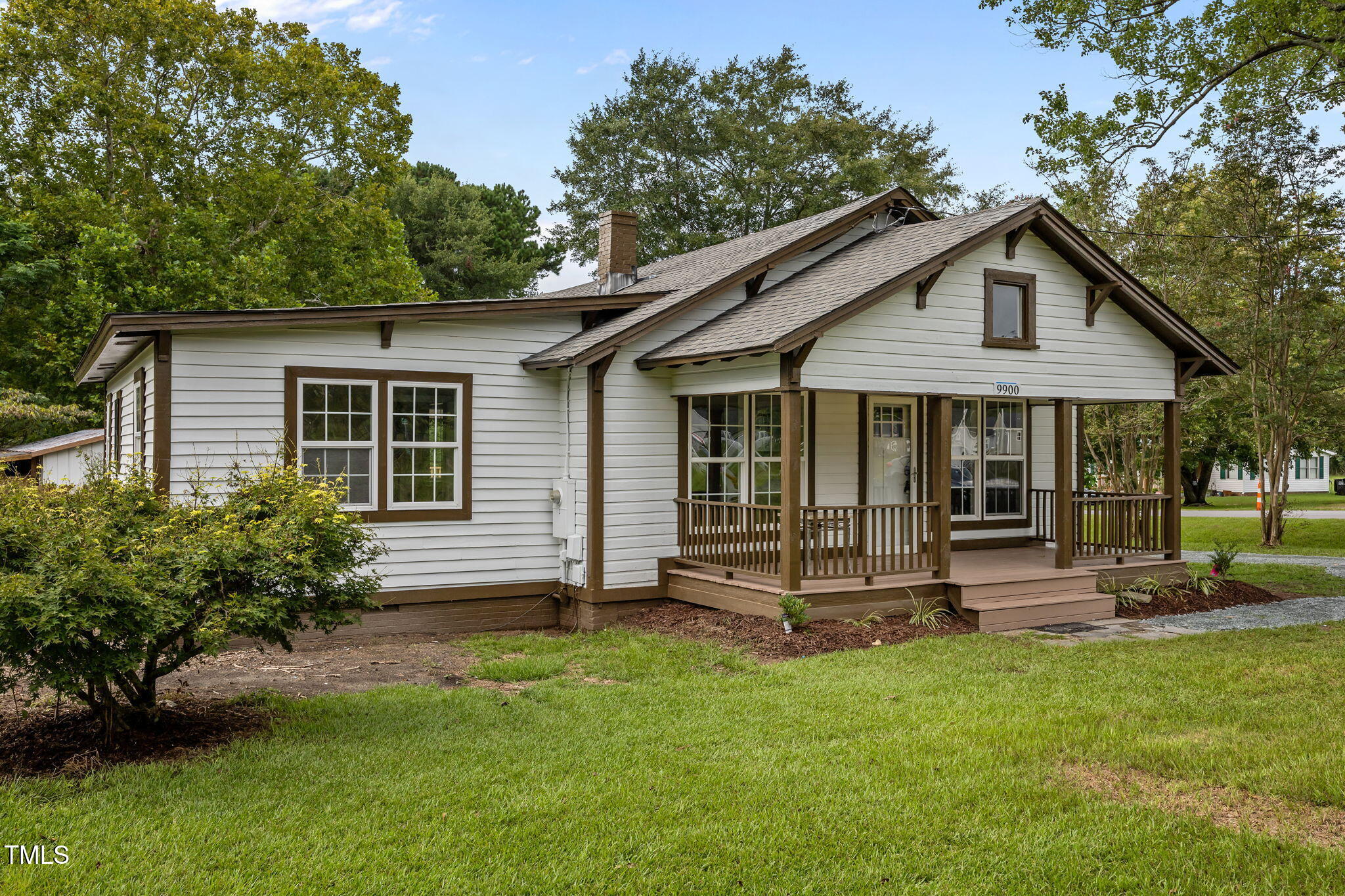 9900 Kennebec Church Road Angier, NC 27501 - Photo 40 of 41 a front view of house with a garden and patio