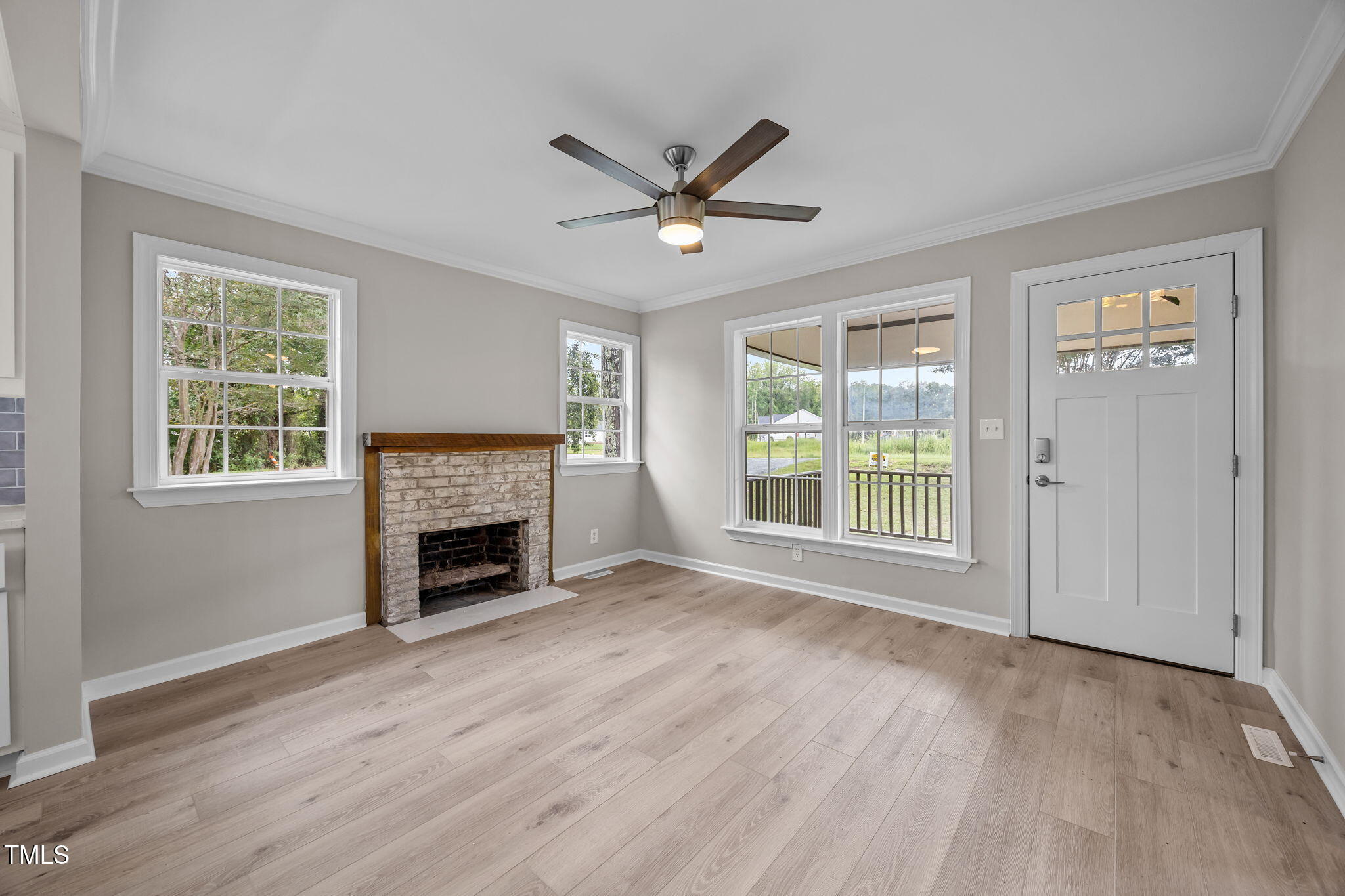 9900 Kennebec Church Road Angier, NC 27501 - Photo 5 of 41 a view of an empty room with window and fire place