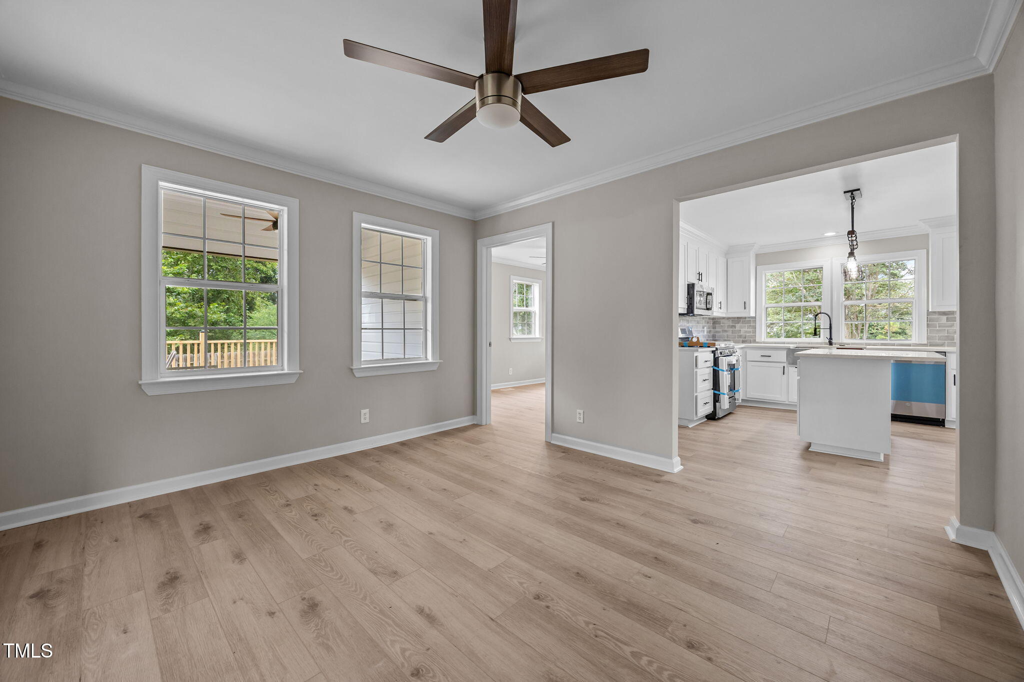 9900 Kennebec Church Road Angier, NC 27501 - Photo 6 of 41 a view of an empty room with a window and wooden floor