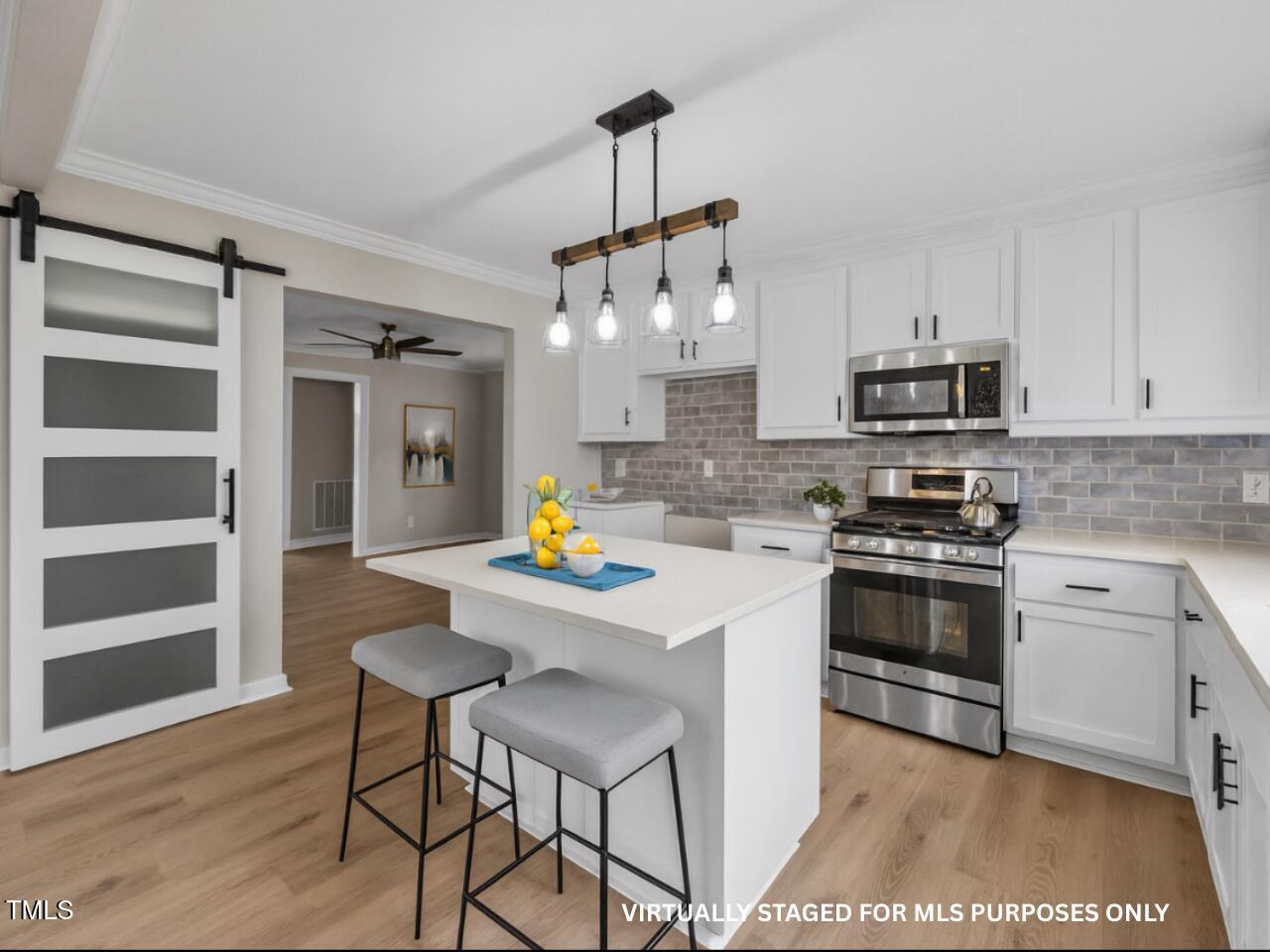 9900 Kennebec Church Road Angier, NC 27501 - Photo 9 of 41 a kitchen with a stove a sink and a refrigerator