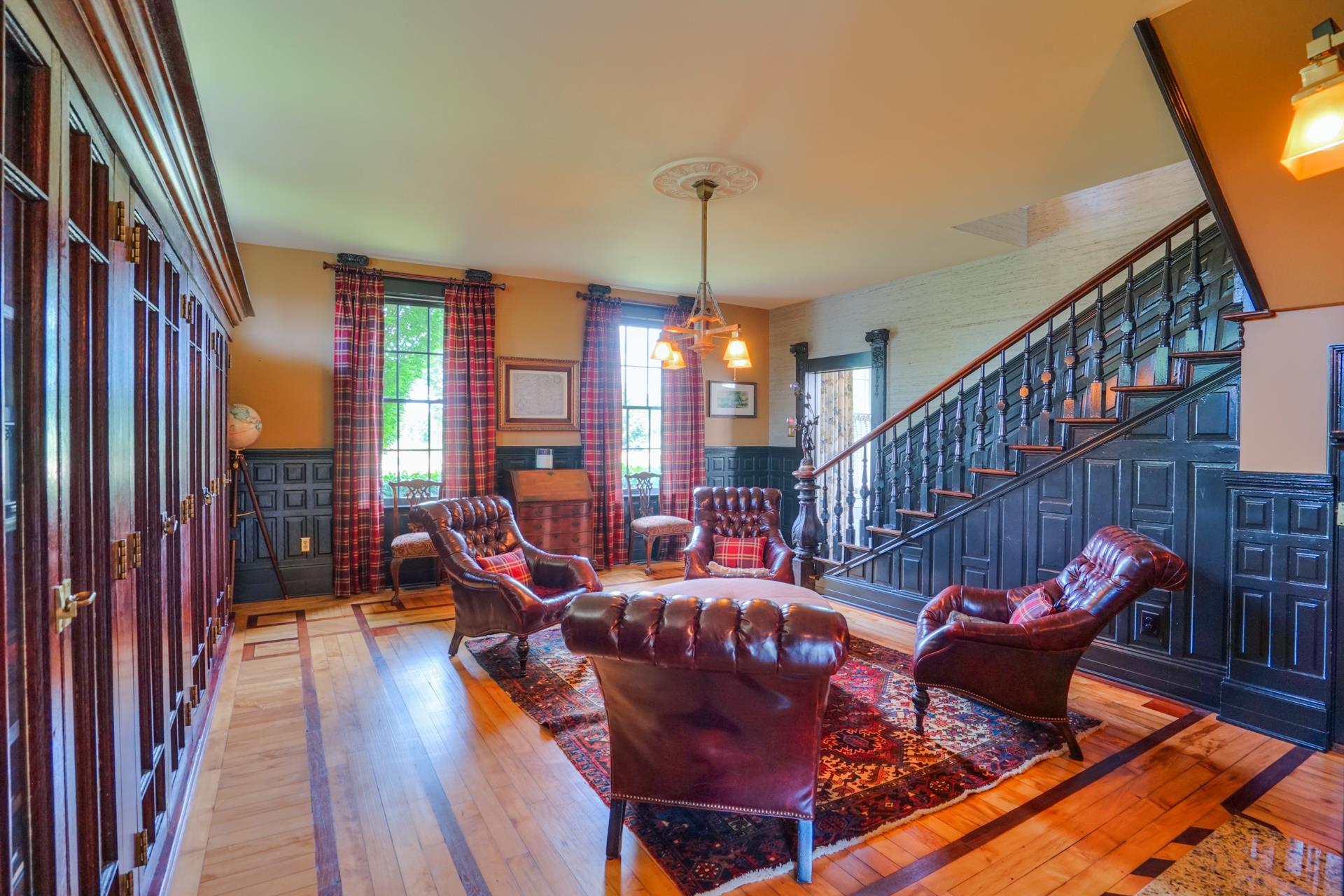 8483 Taliaferro Road Eagleville, TN 37060 - Photo 11 of 30 a living room with furniture or stairs and a chandelier