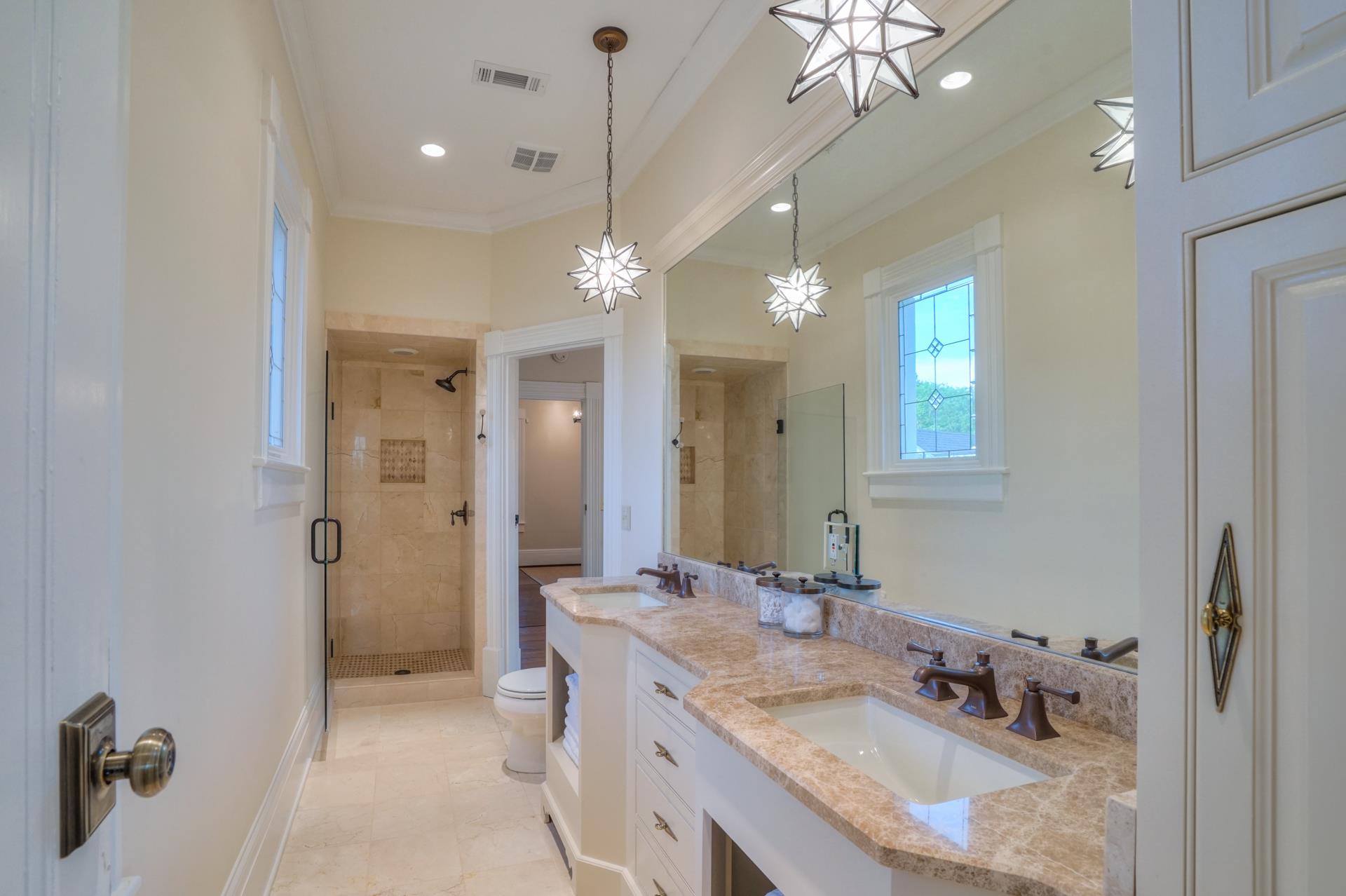 8483 Taliaferro Road Eagleville, TN 37060 - Photo 18 of 30 a bathroom with a granite countertop sink a light fixture and a mirror