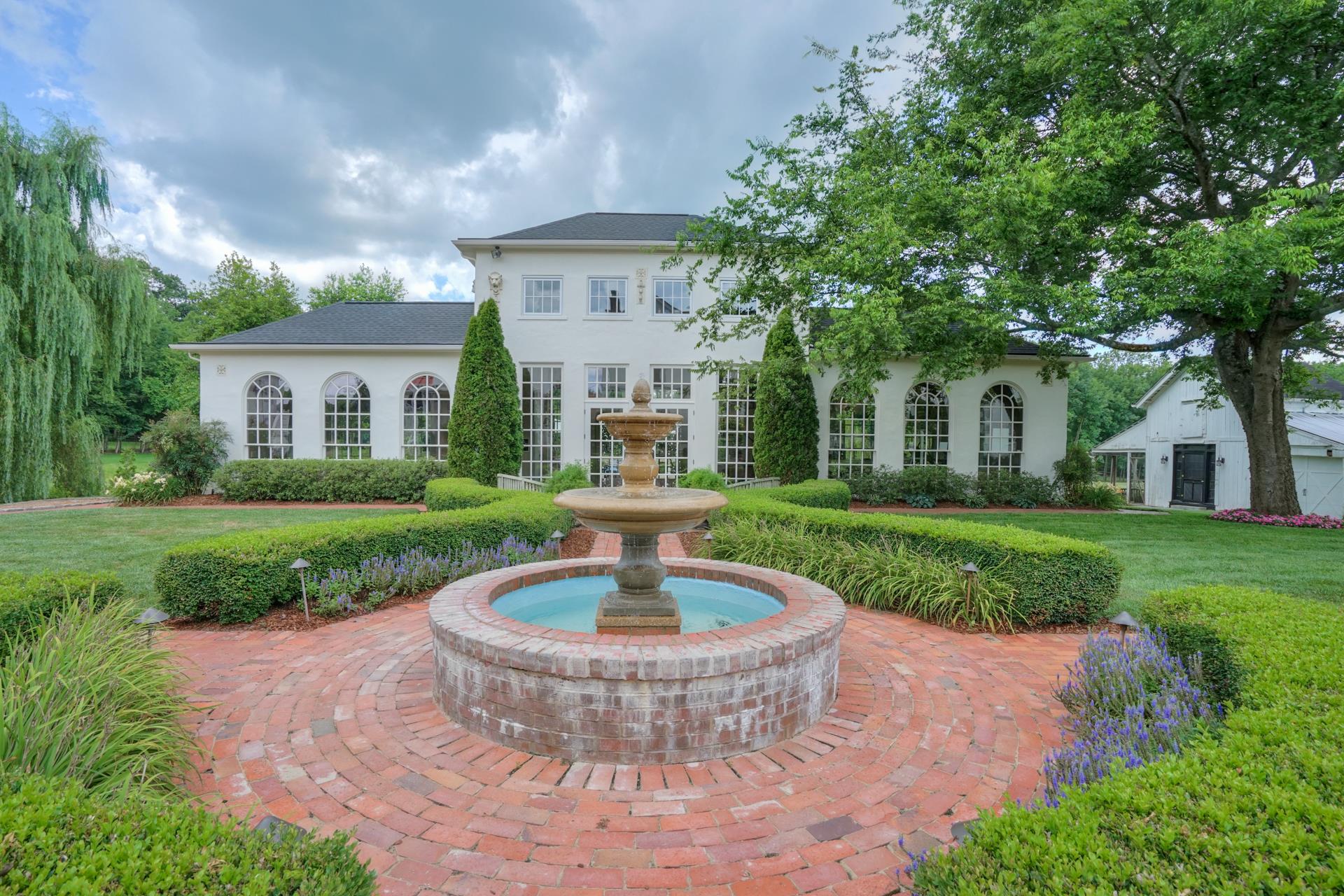 8483 Taliaferro Road Eagleville, TN 37060 - Photo 20 of 30 a view of a house with a swimming pool and a yard