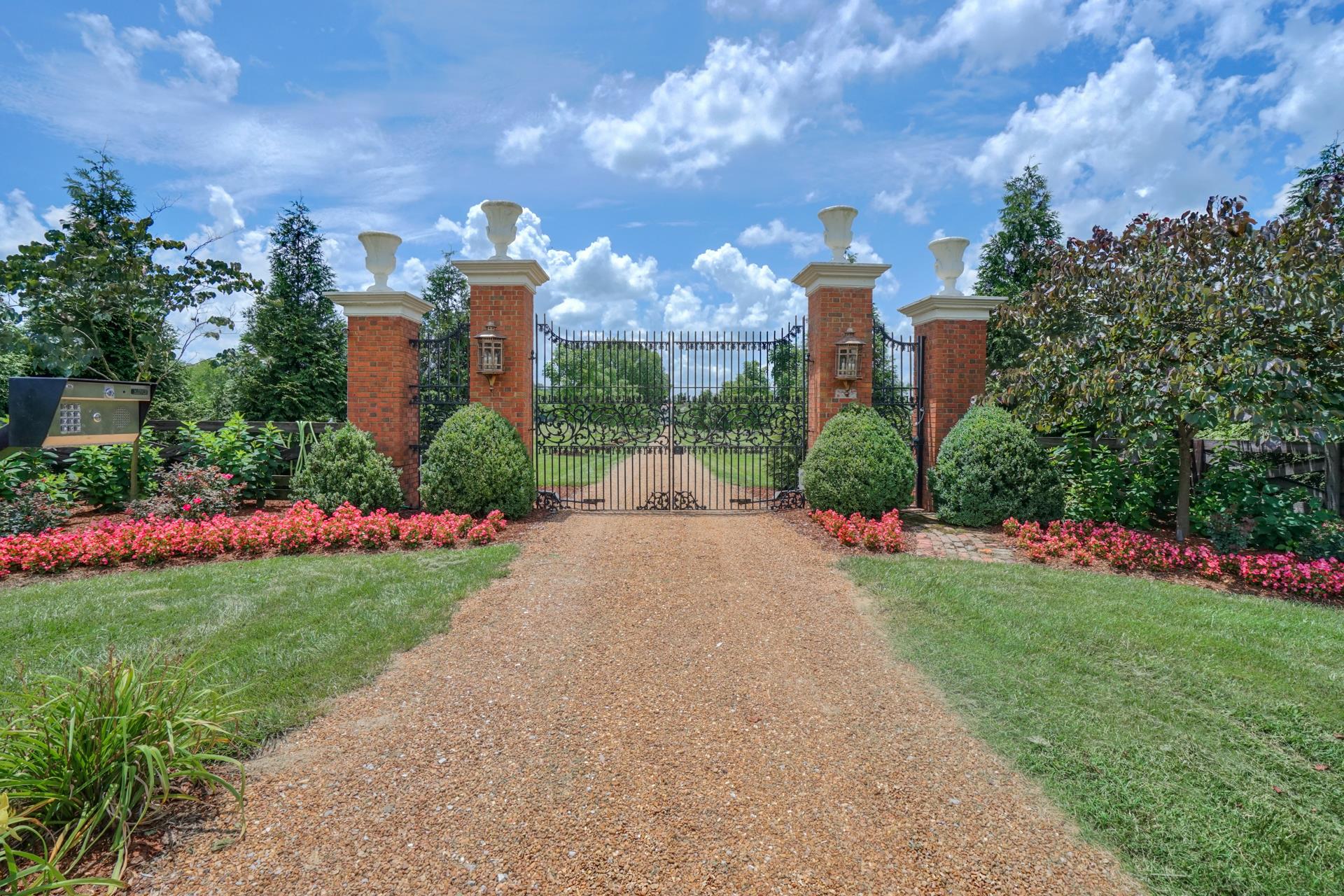 8483 Taliaferro Road Eagleville, TN 37060 - Photo 2 of 30 a view of a city with tall building and a big yard