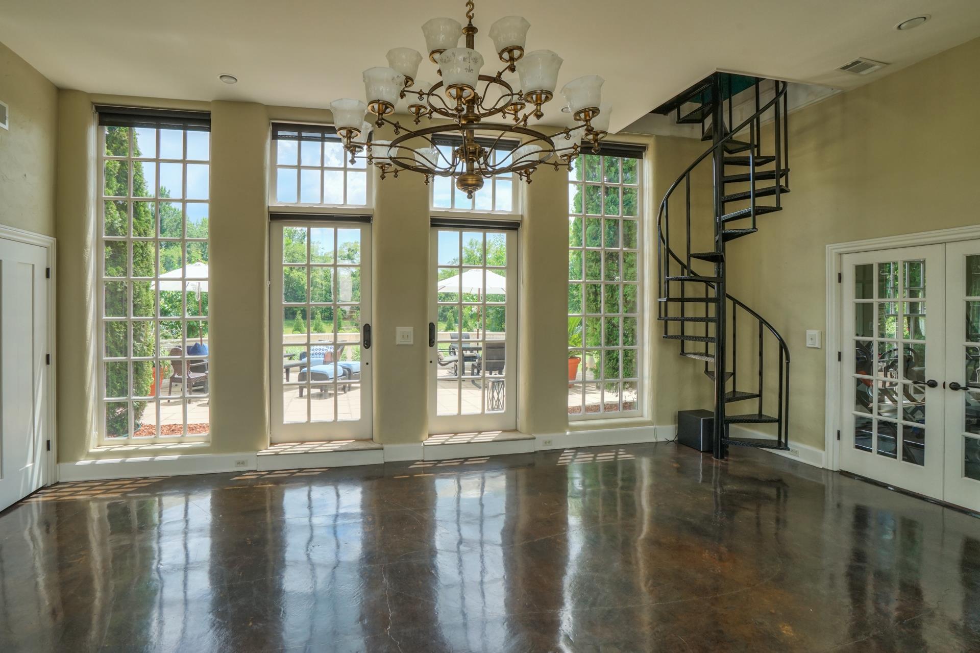 8483 Taliaferro Road Eagleville, TN 37060 - Photo 23 of 30 a view of a room with windows and chandelier