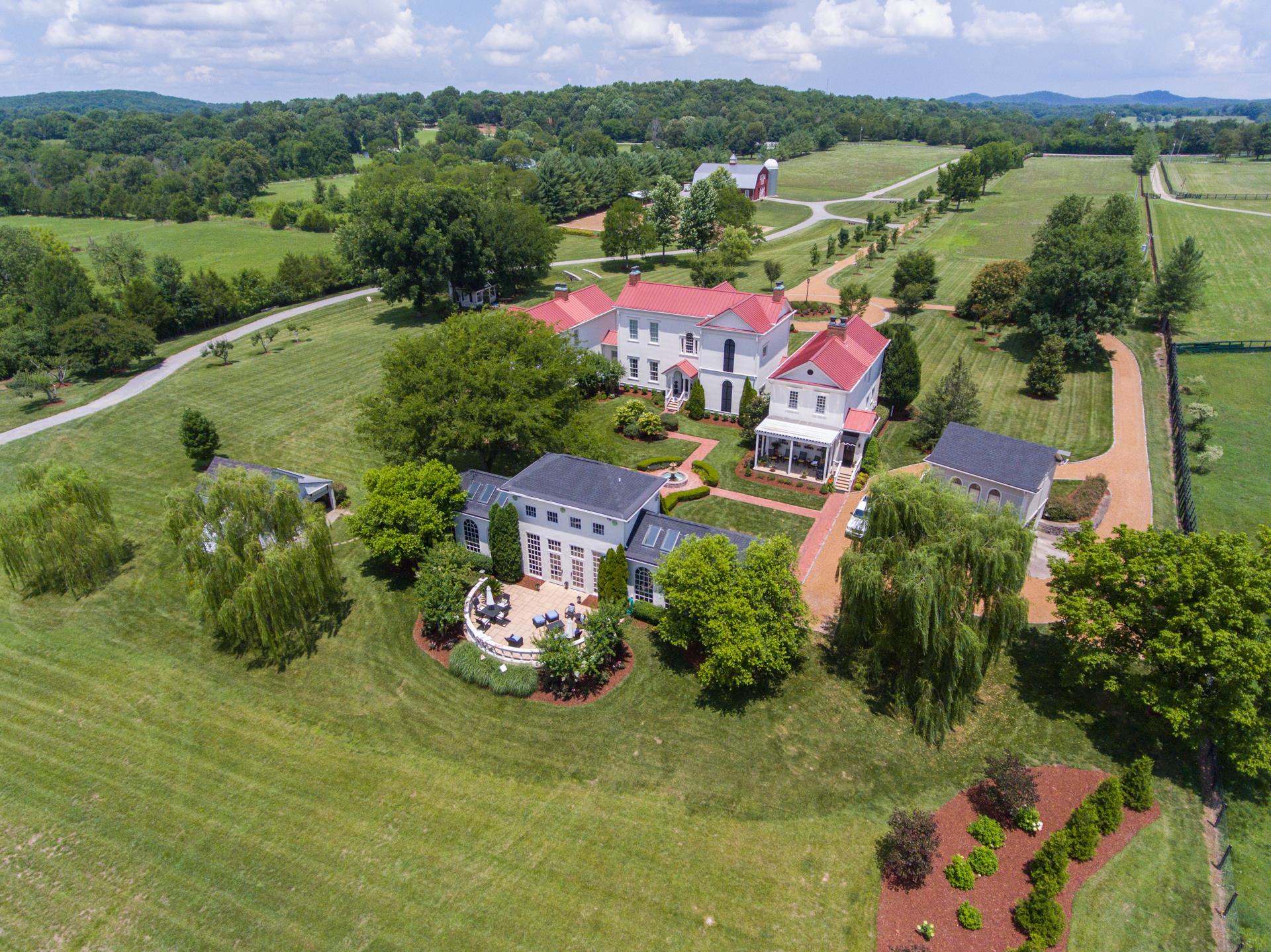 8483 Taliaferro Road Eagleville, TN 37060 - Photo 30 of 30 an aerial view of a house with a garden and lake view