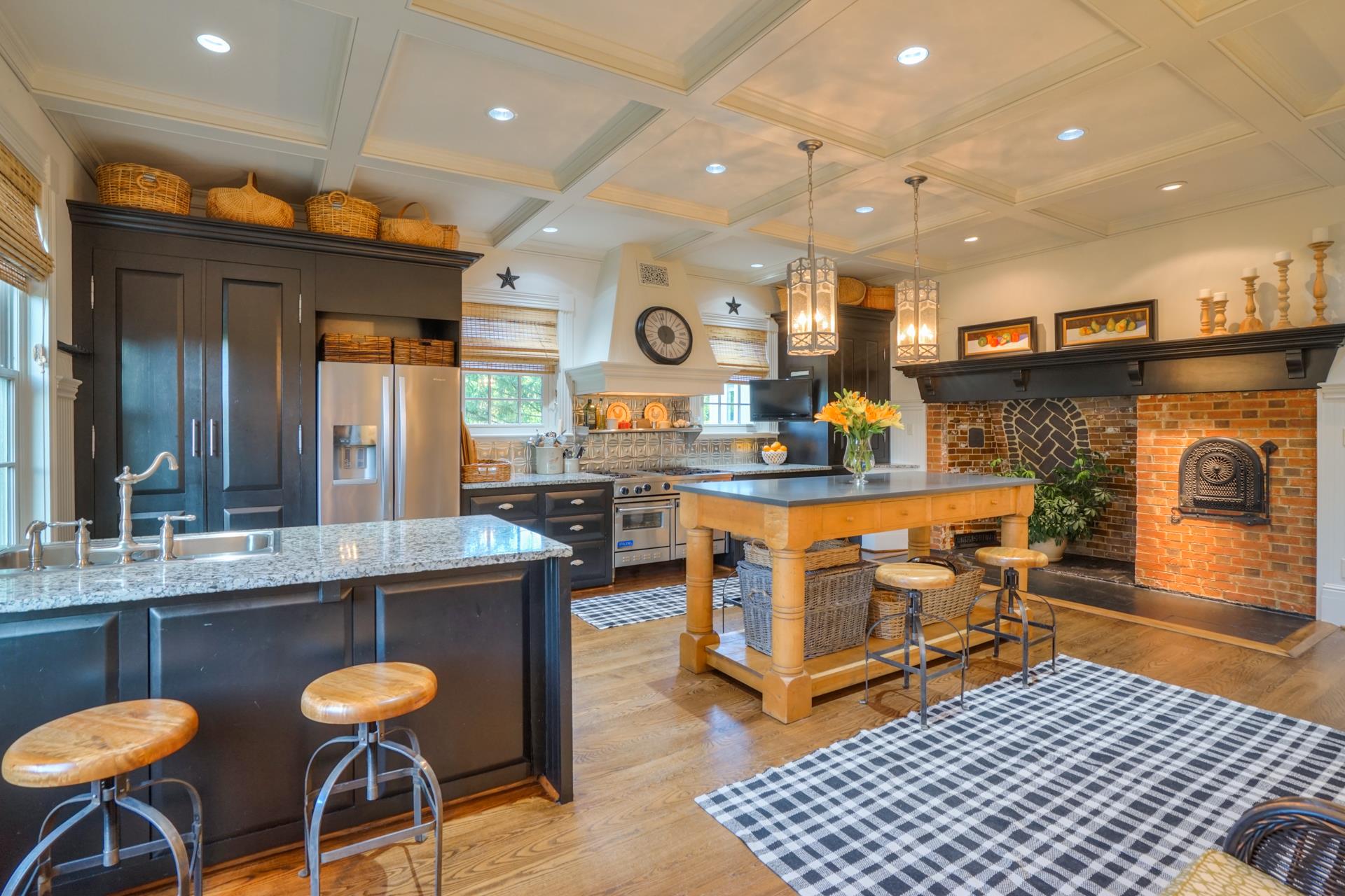 8483 Taliaferro Road Eagleville, TN 37060 - Photo 9 of 30 a kitchen with stainless steel appliances granite countertop a stove a sink and a dining table