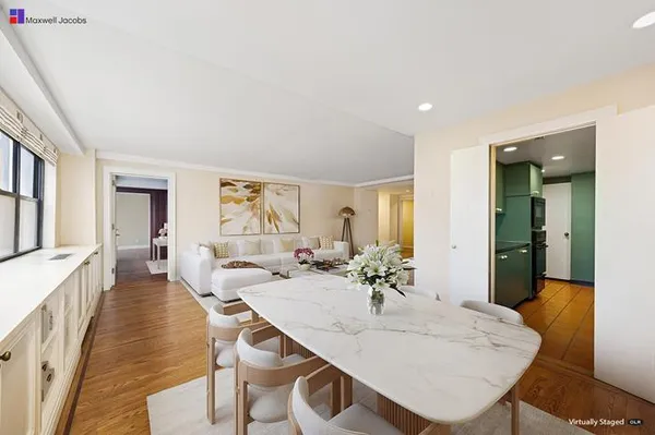 a dining room with furniture and window