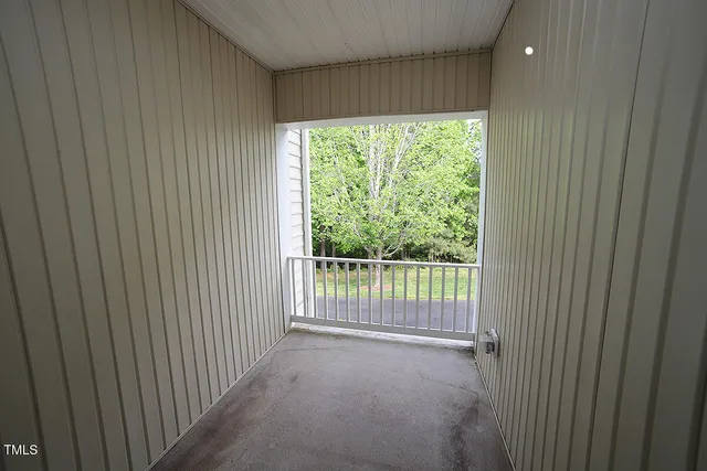 a view of a room that has a large window
