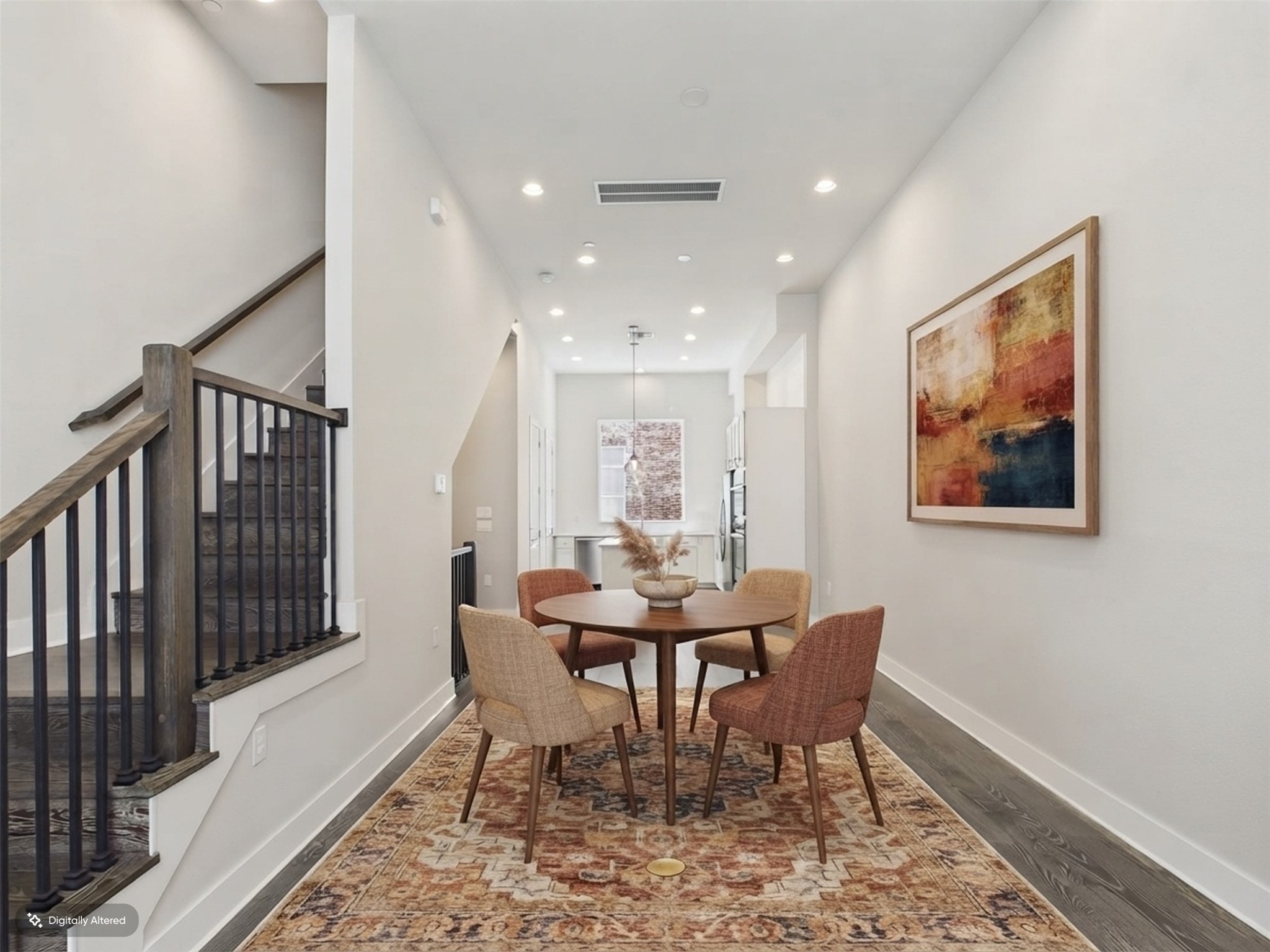 1308 Tinnin Ford Road, Unit 14 Austin, TX 78741 - Photo 11 of 40 Smooth plaster walls and dark hardwood floors frame a long, modern dining space.