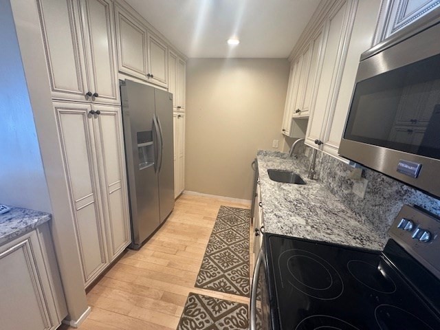 1 Seal Harbor Road, Unit 210 Winthrop, MA 02152 - Photo 11 of 27 a bathroom with a granite countertop sink and a mirror