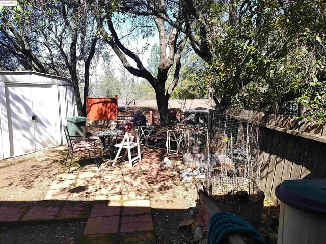 a view of outdoor space with table and chairs