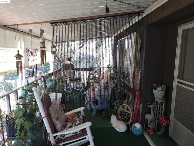 a outdoor living space with furniture and a rug