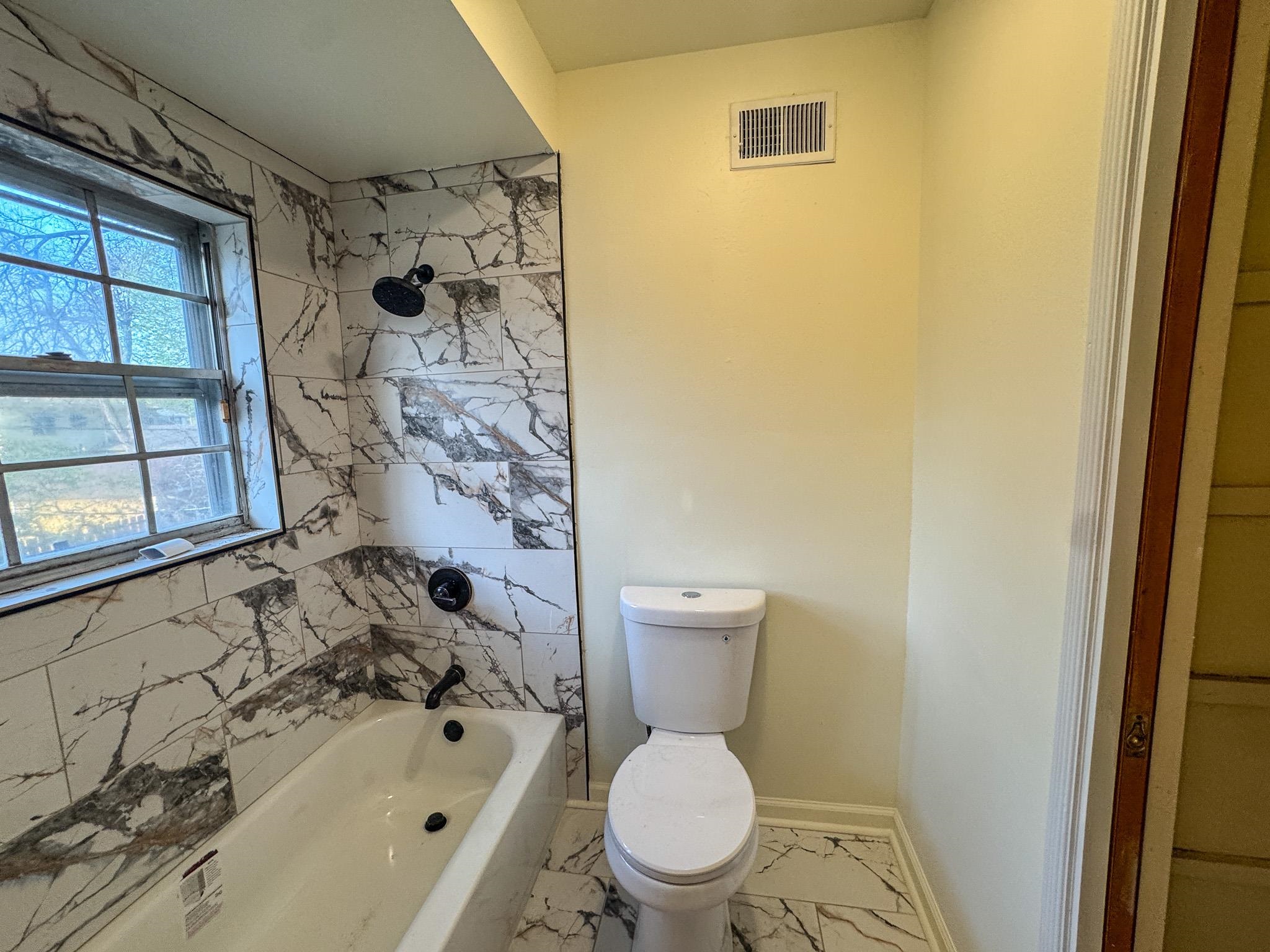 1345 Hickory Ridge Cove Memphis, TN 38116 - Photo 20 of 26 a bathroom with a toilet and a shower