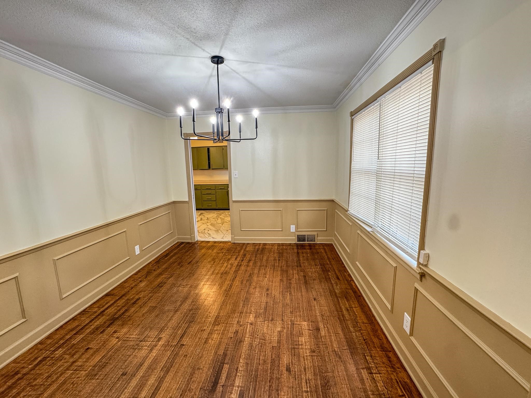 1345 Hickory Ridge Cove Memphis, TN 38116 - Photo 5 of 26 a view of a room with wooden floor and window