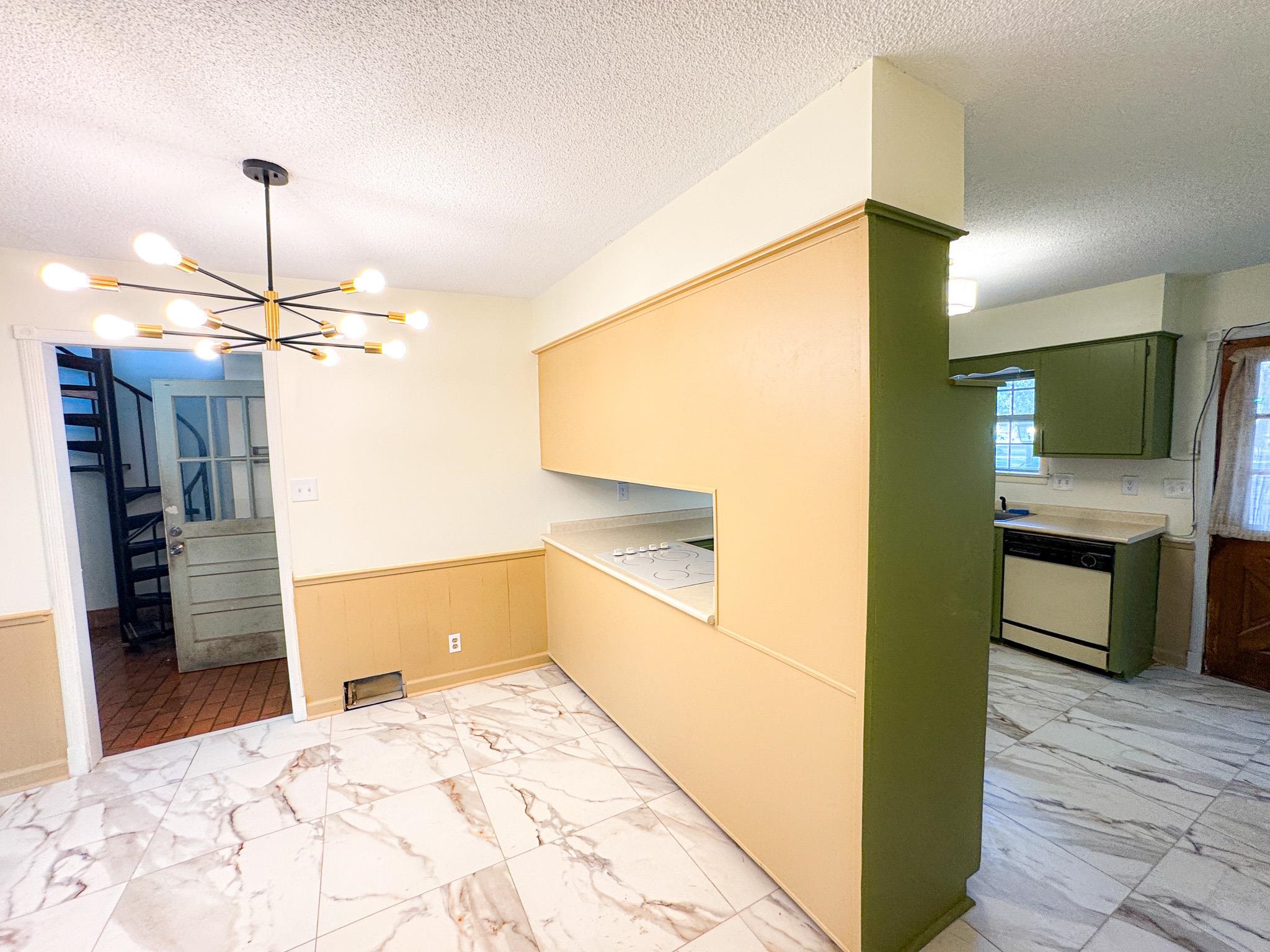 1345 Hickory Ridge Cove Memphis, TN 38116 - Photo 9 of 26 a kitchen with a refrigerator and a sink
