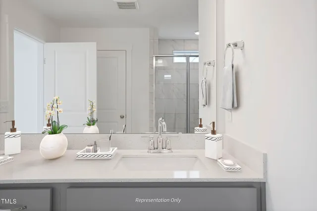 a bedroom with a large bed and a couch