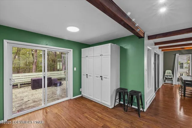 a view of livingroom with furniture and a window
