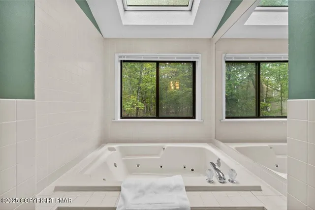 a bedroom with a bed and a table