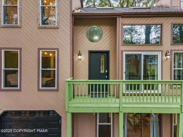 a front view of a house with a deck