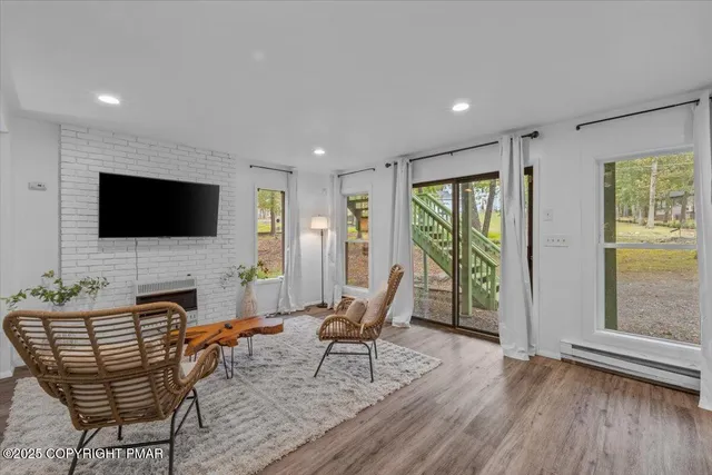 a view of a house with garden and trees