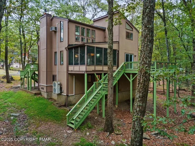 a view of a house with swimming pool