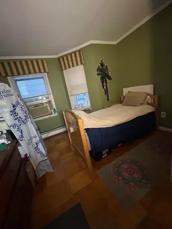 a living room filled with furniture and a flat screen tv