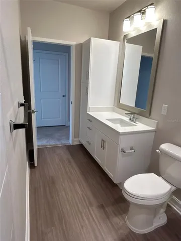 a view of room with a ceiling fan and a window