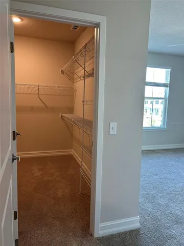 a view of a room with racks on the wall