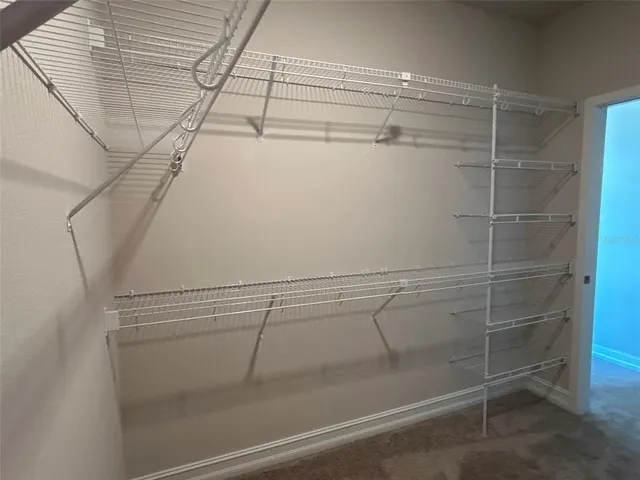 a view of a room with racks on the wall