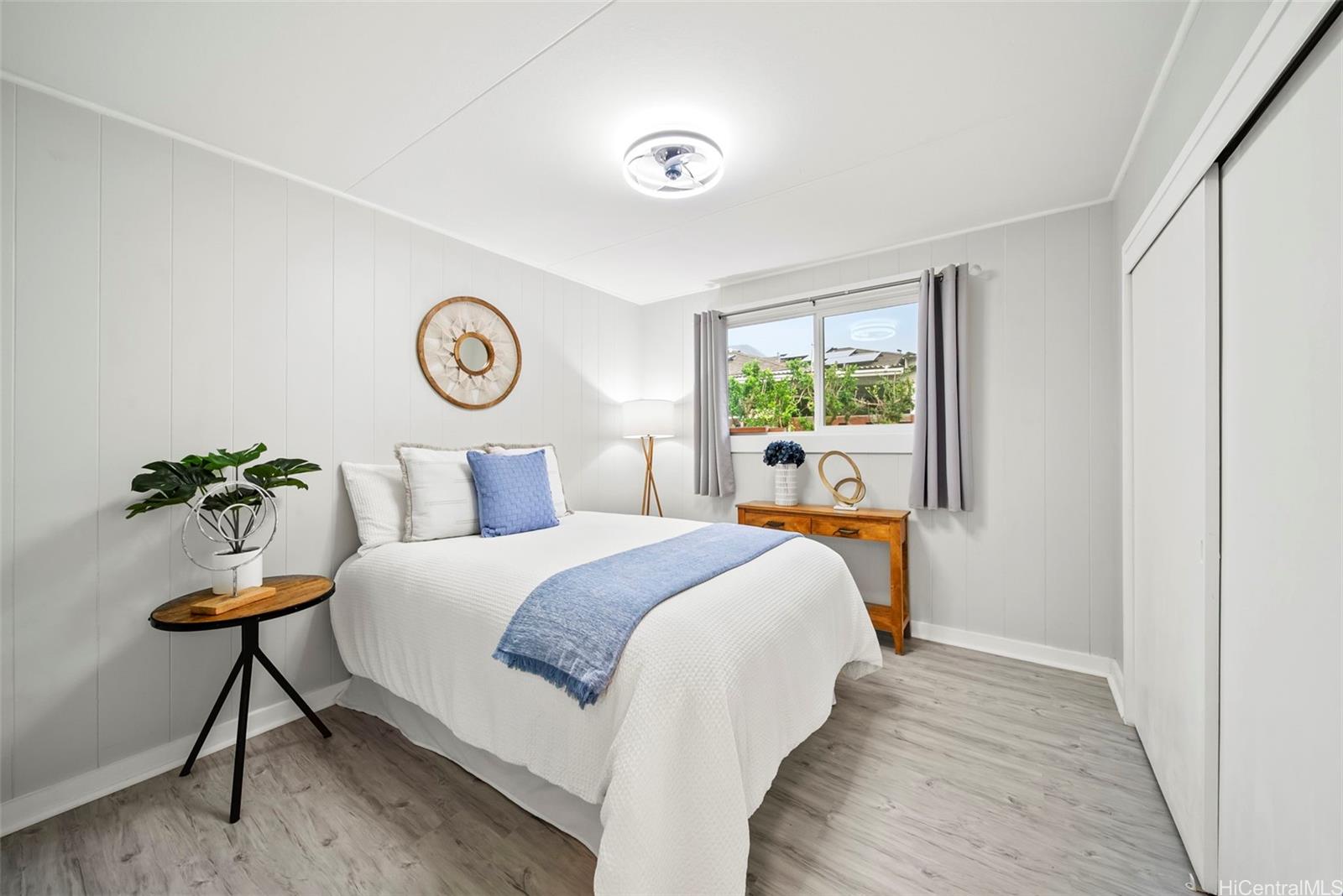 809 Hao Street Honolulu, HI 96821 - Photo 22 of 25 a bed room with a bed and a chair