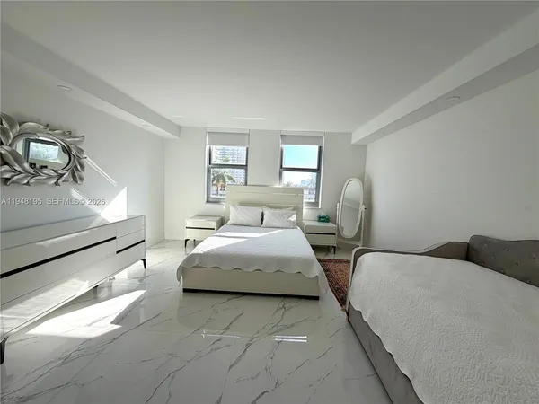 a bedroom with double bed and window