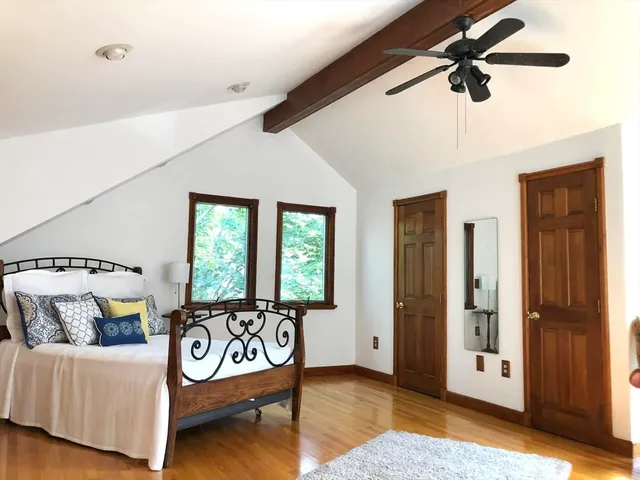 a bathroom with a granite countertop sink and a large mirror