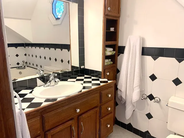 a bathroom with a bathtub and a toilet