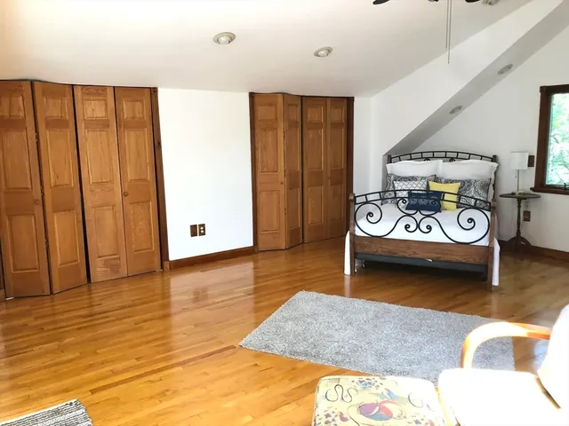 a view of a livingroom with furniture and a ceiling fan