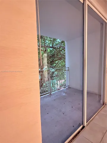 a view of a room with a large window