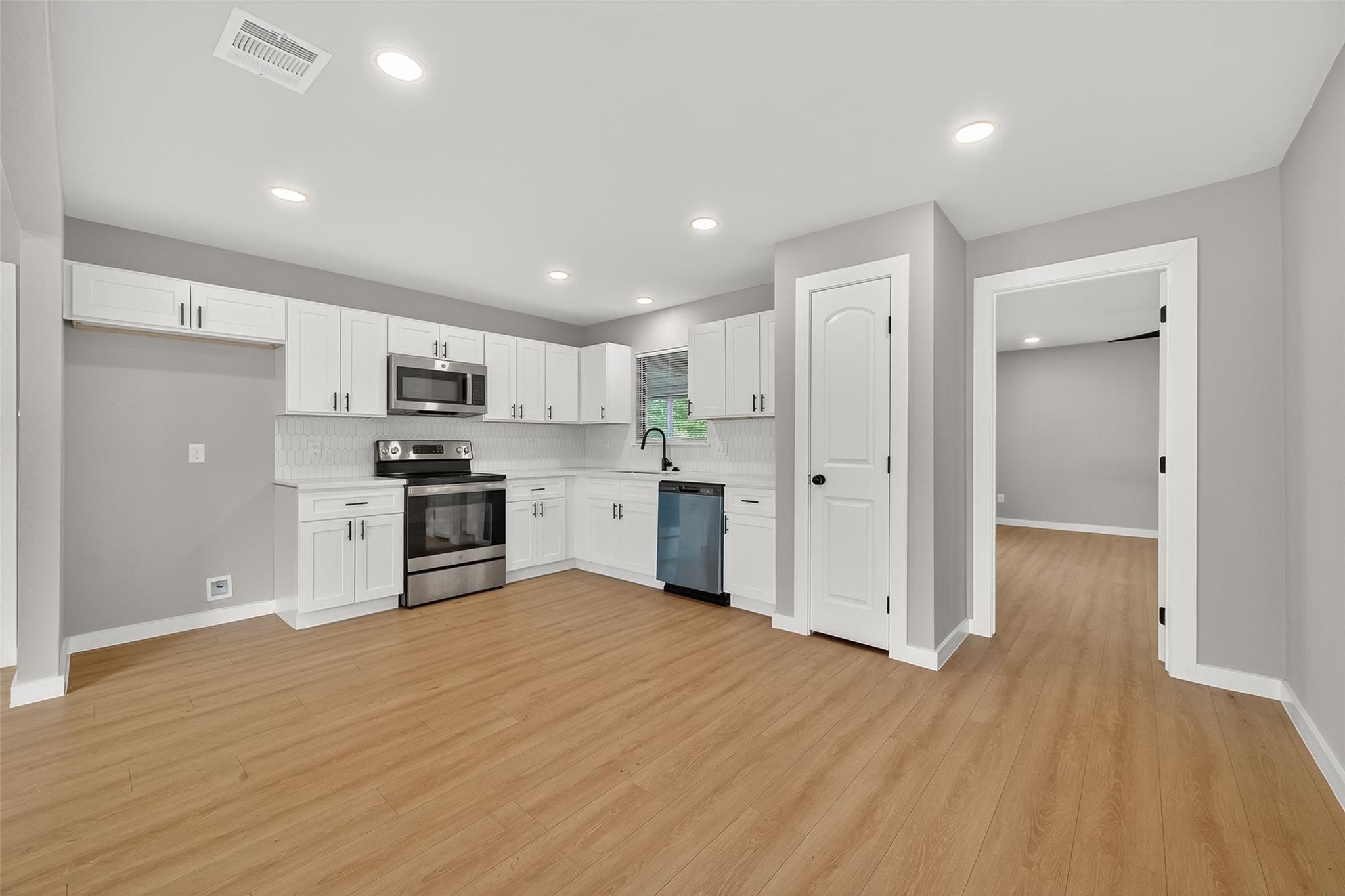 a view of kitchen with wooden floor